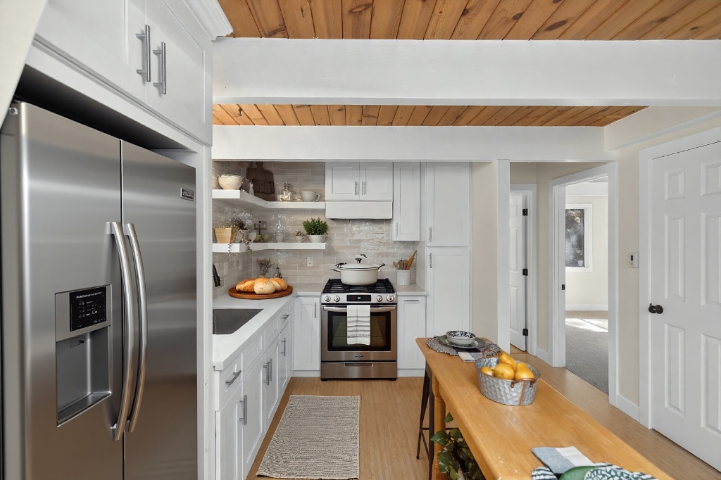 Bright kitchen with wood ceiling and stainless appliances