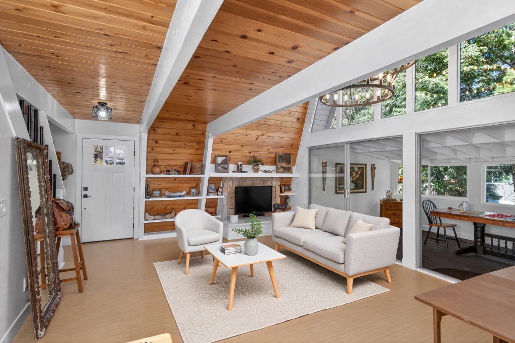 A-frame cabin living room with wood ceiling and open layout