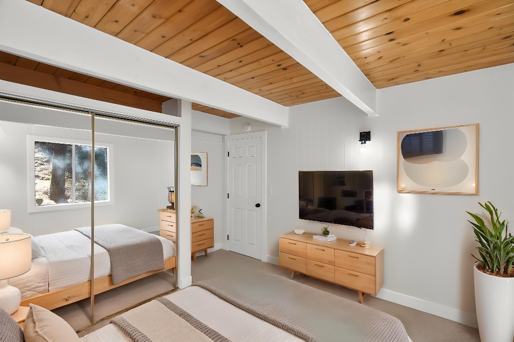 Master bedroom with warm tones and dresser