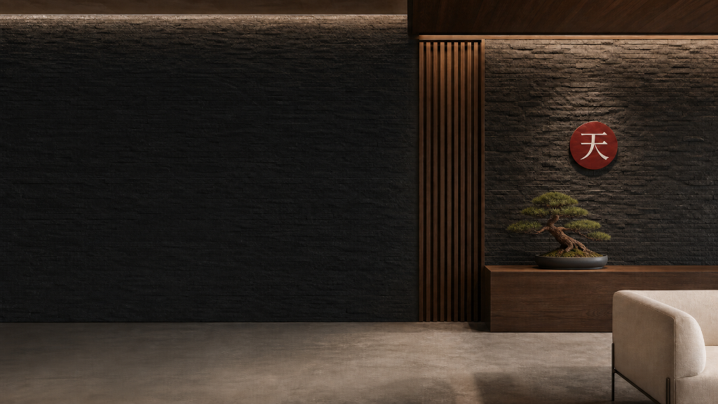 Slate-stone interior with the Tenkai wall emblem, a sculpted bonsai, and a walnut credenza beneath warm architectural lighting.