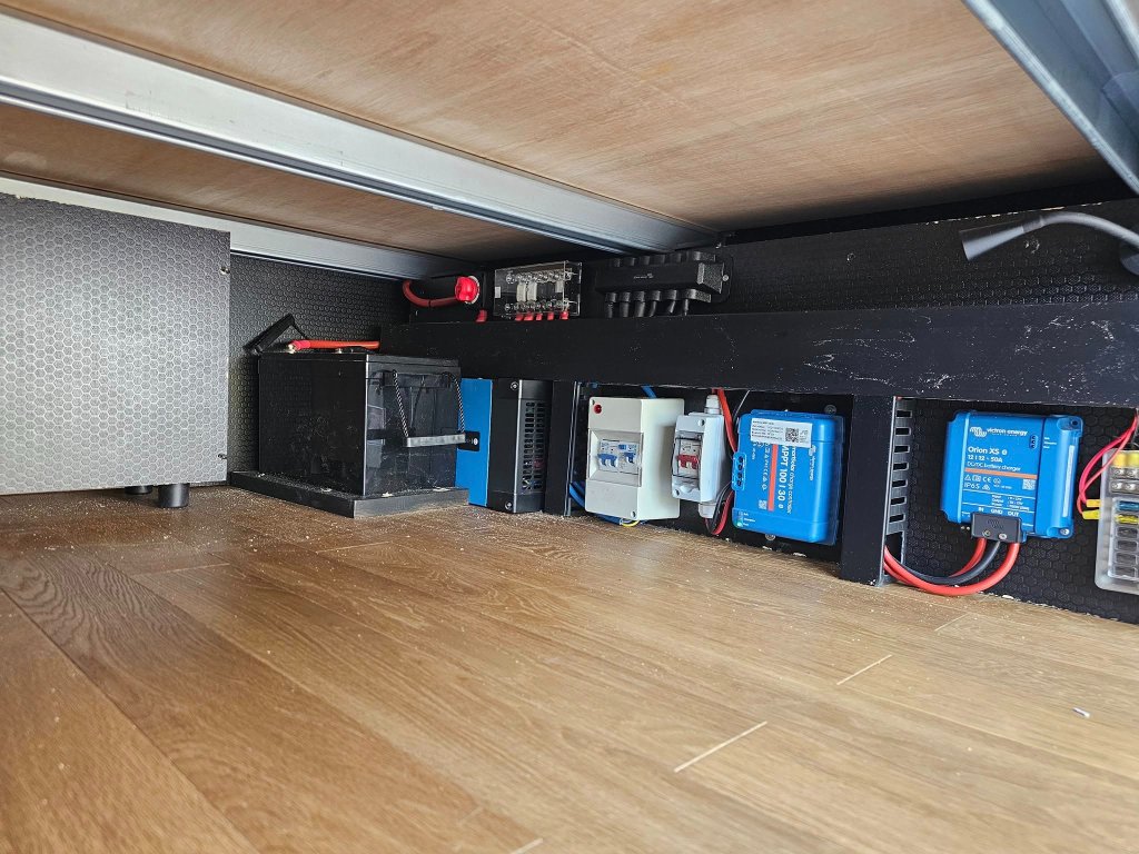 Under-bed electrical bay in campervan conversion by ALP Vans - hidden 12V system installation UK