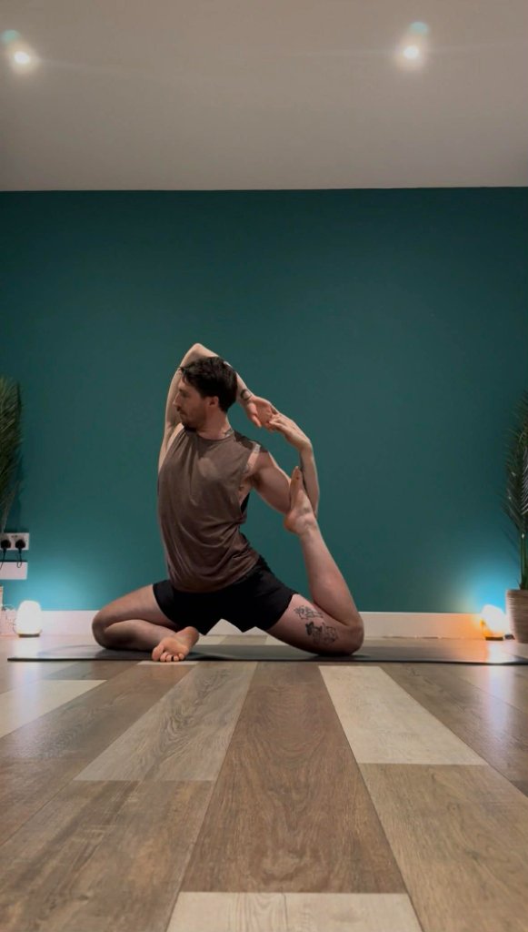 Yoga instructor Max Walsh in a deep hip-opening posture