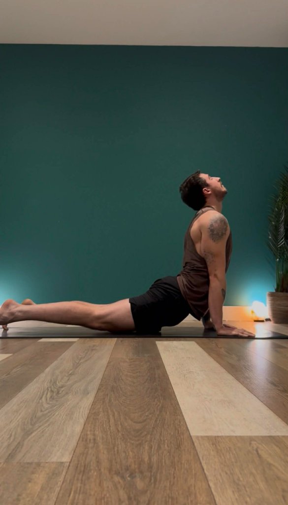 Yoga instructor Max Walsh demonstrating a standing balance pose