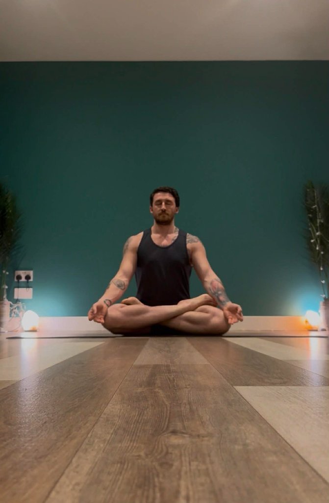 Yoga instructor Max Walsh demonstrating an advanced asana