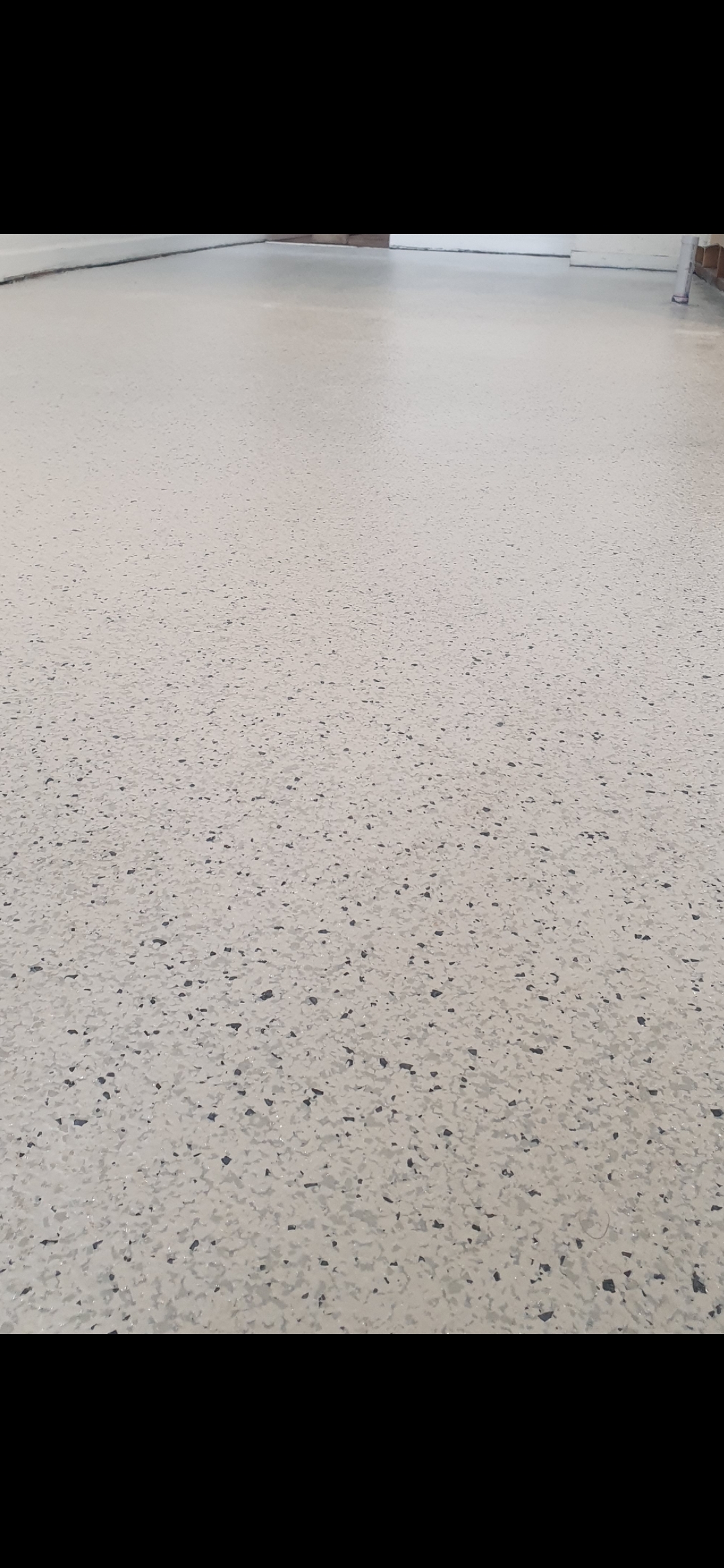 High-gloss commercial epoxy floor coating Adelaide - premium quality installation showing reflective finish and durability for retail showrooms and warehouses