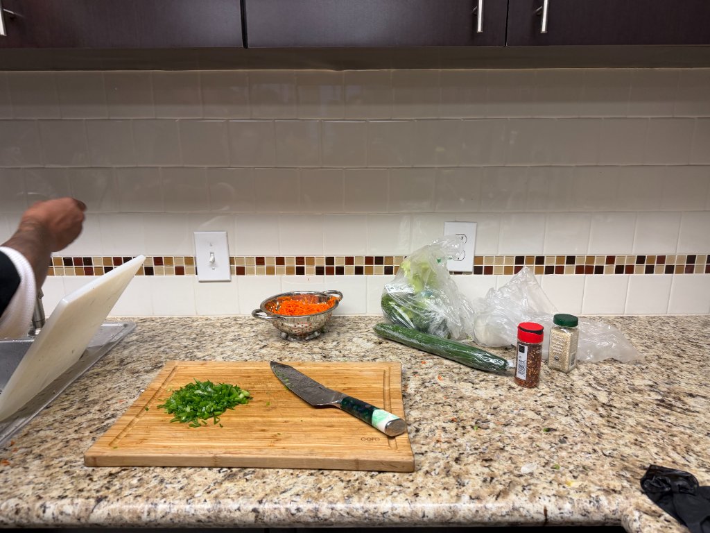 Prepped vegetables and seasonings on the counter