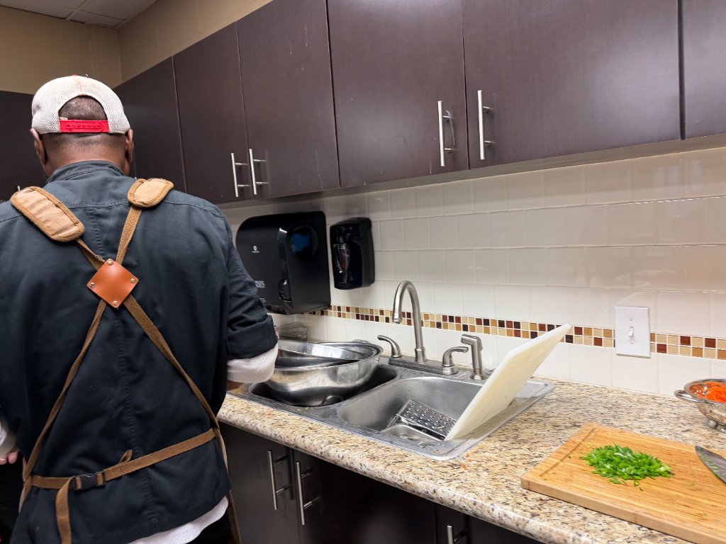 Chopping green onions on a bamboo cutting board