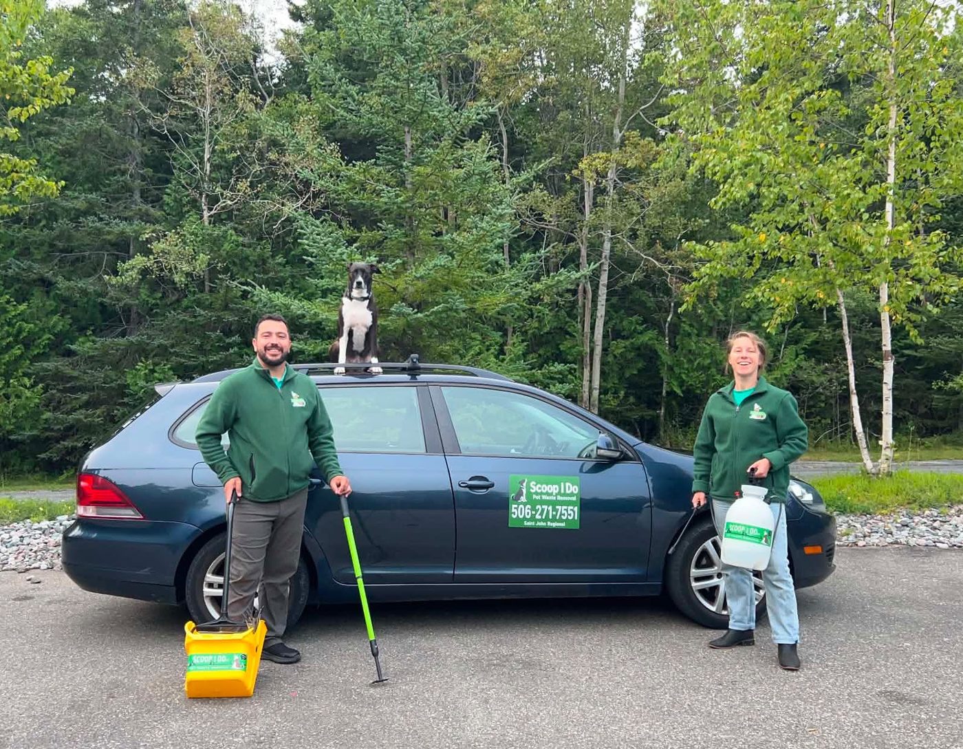 The Scoop I Do team with the service vehicle and their dog