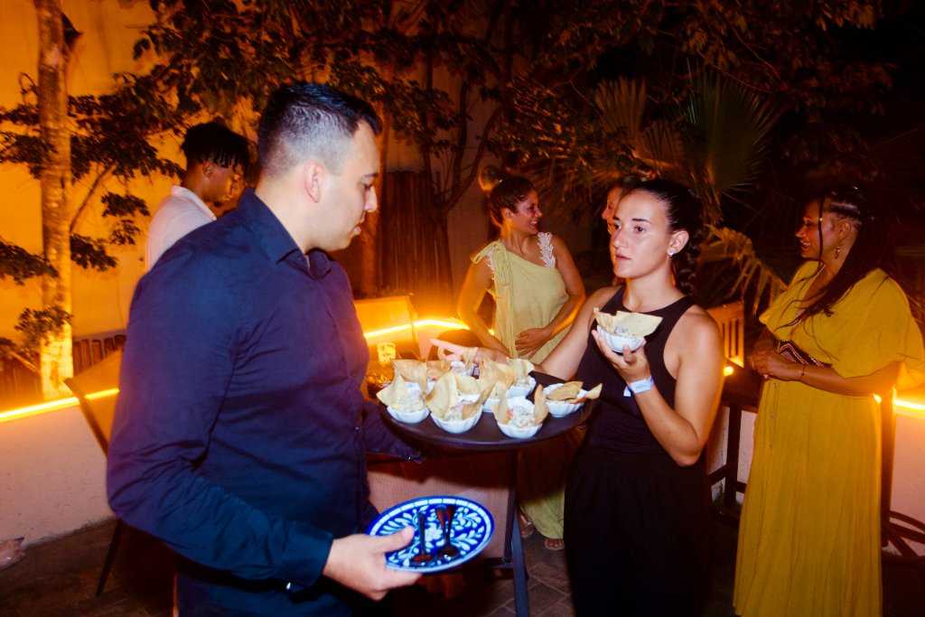 Server passing ceviche at Tulum dinner event