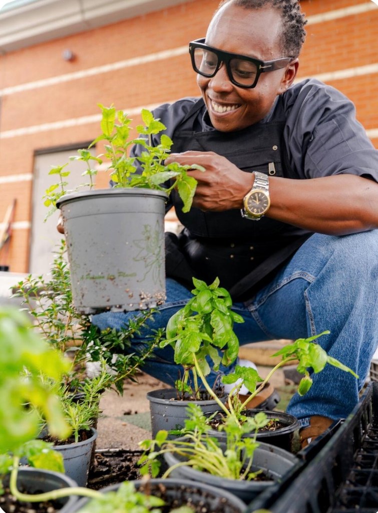 Chef Maubs with potted herbs