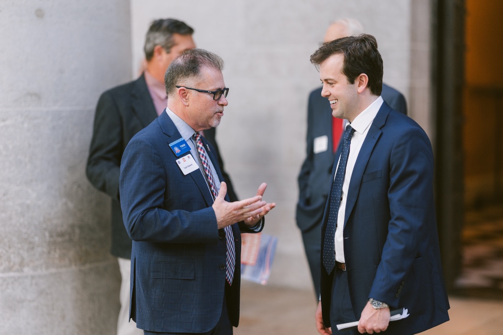 Two attendees in conversation