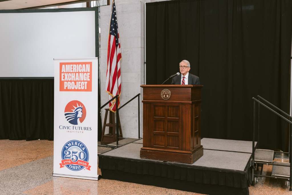 Governor speaking at the podium