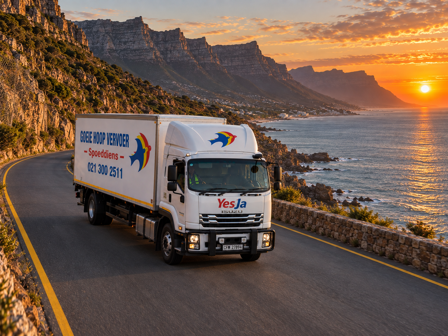 GHVS YesJa truck on a sunset coastal highway near Cape Town