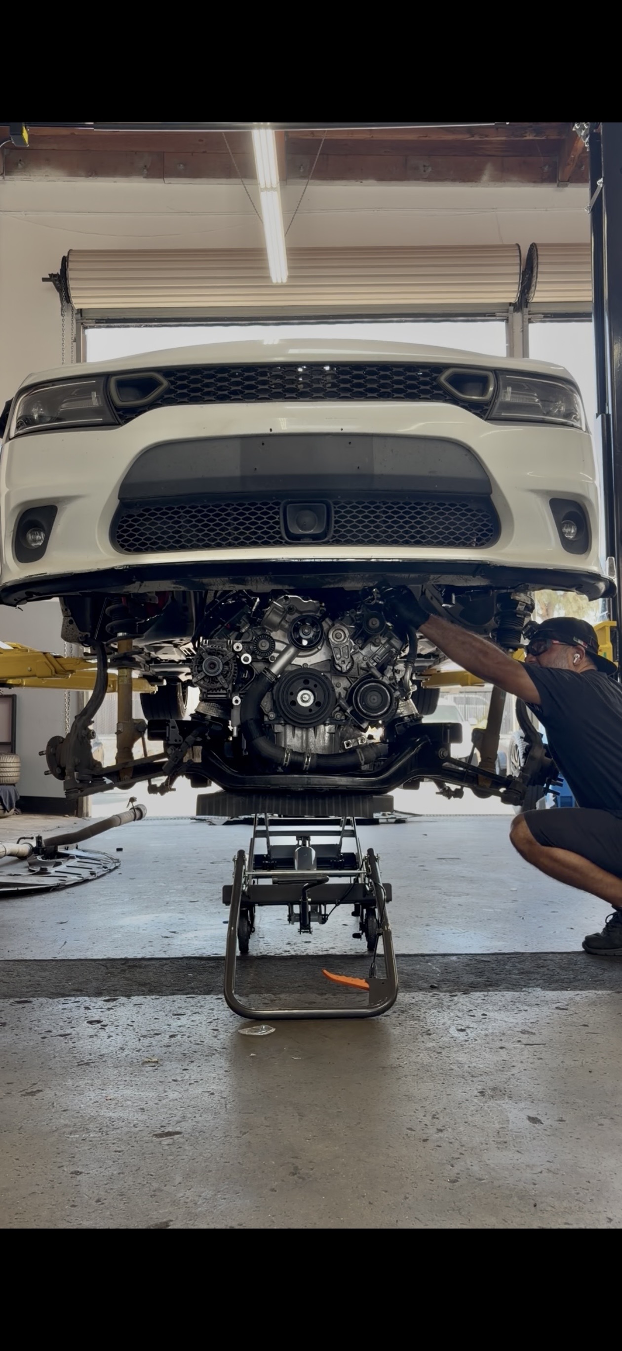 Mechanics working on a vehicle