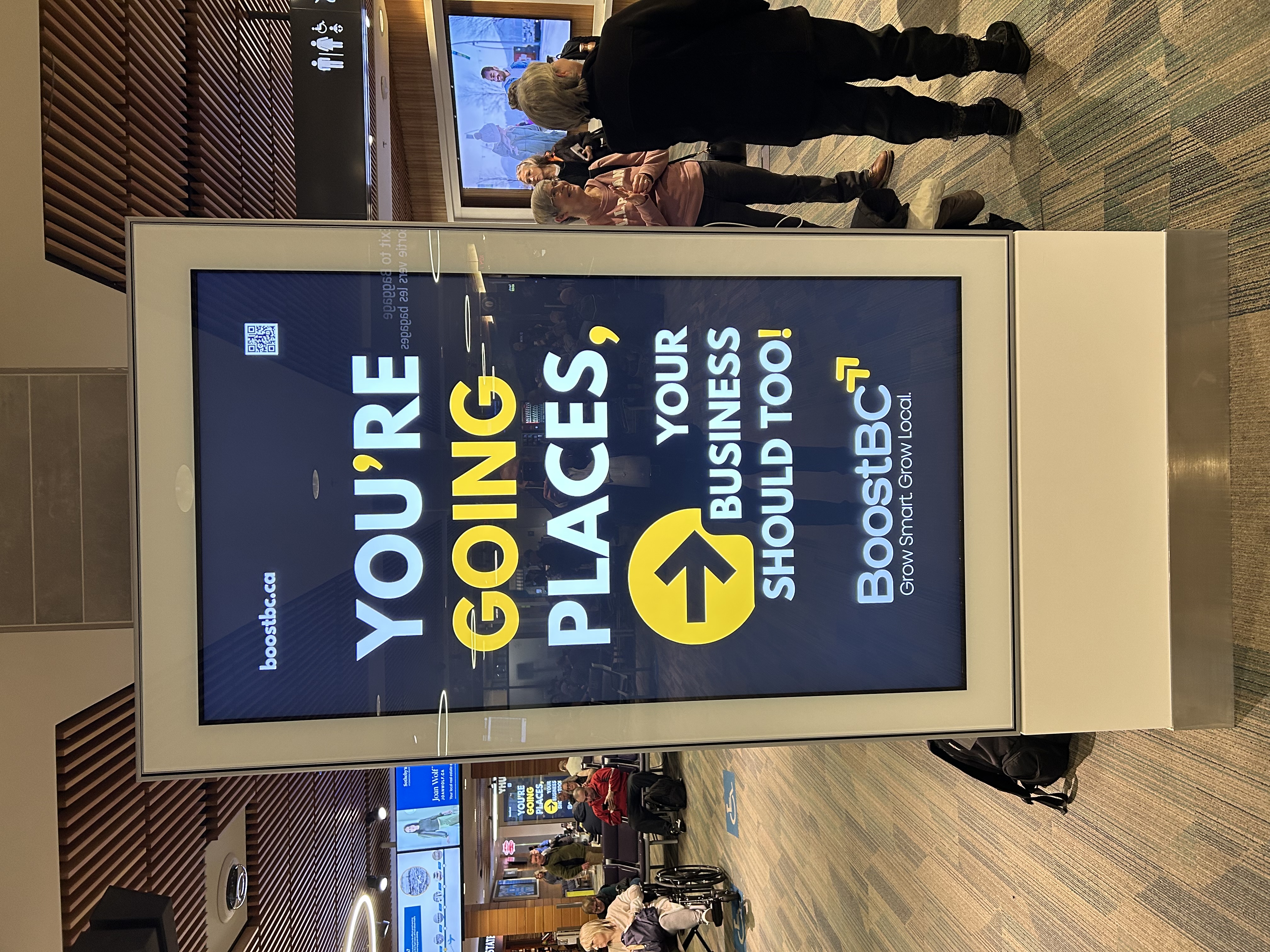 BoostBC airport departures display — You're Going Places, Your Business Should Too