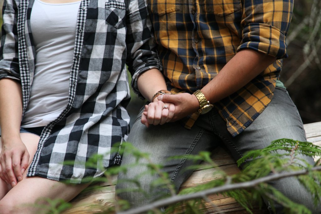 Couple holding hands close up engagement photo