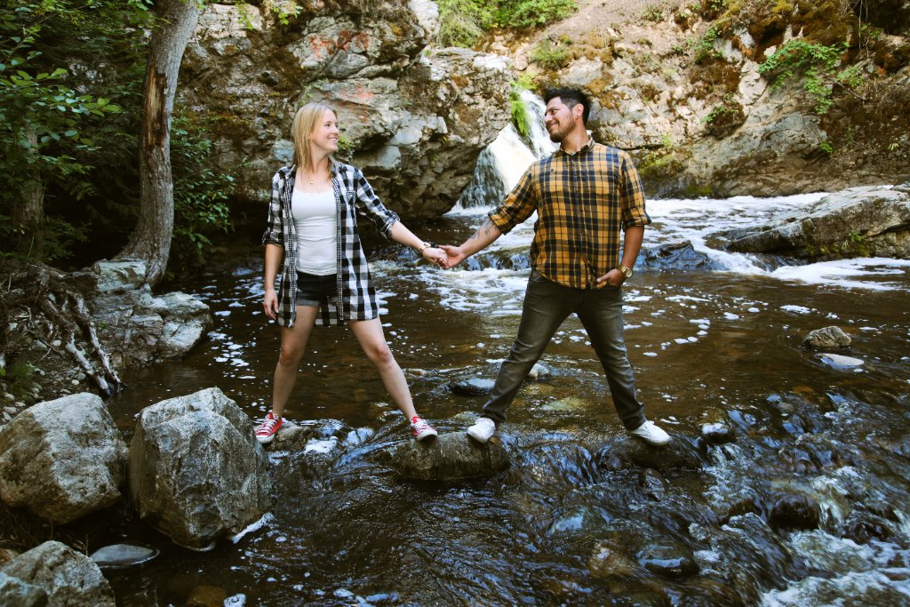 Couple at waterfall engagement photo