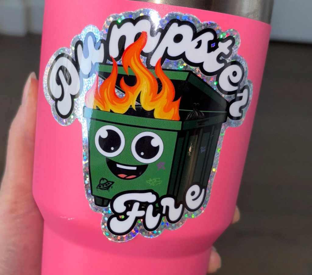 Dumpster Fire holographic sticker on tumbler
