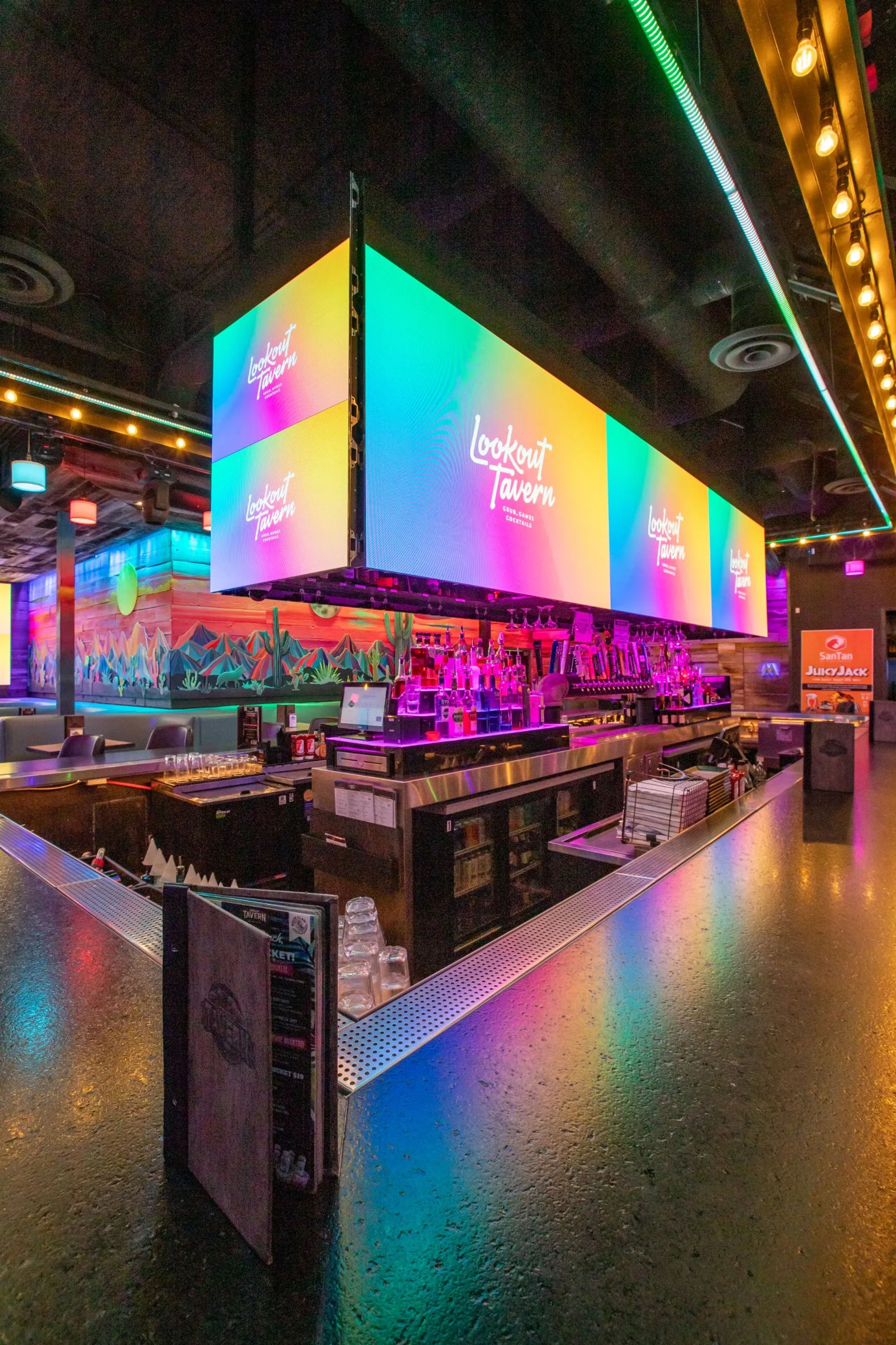 The main bar at Lookout Tavern under the rainbow LED video cube