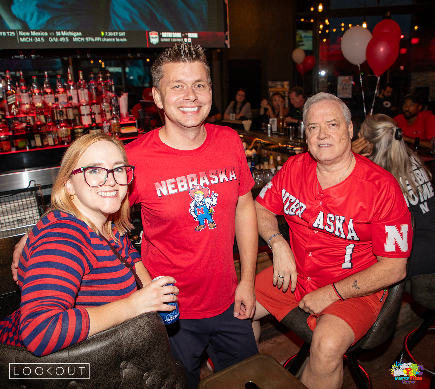 Huskers fans in Nebraska red at the bar