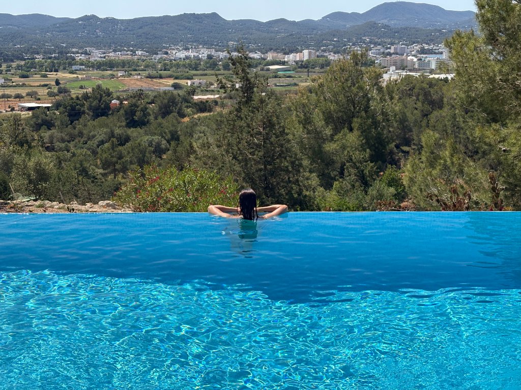 Peaceful moment in an infinity pool overlooking the landscape