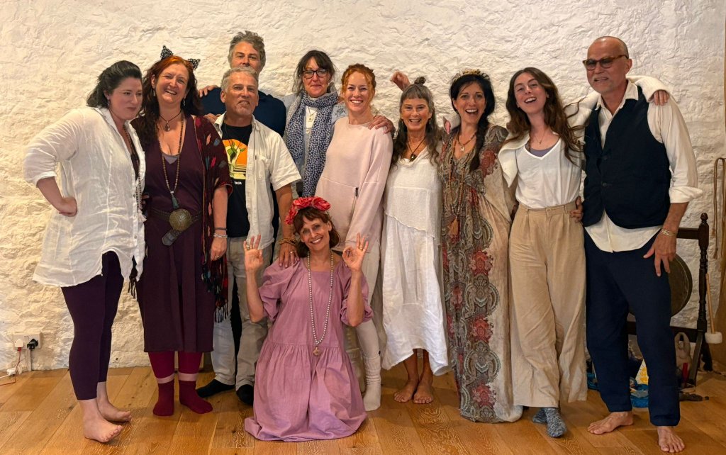 Group gathering of yoga community members in the studio