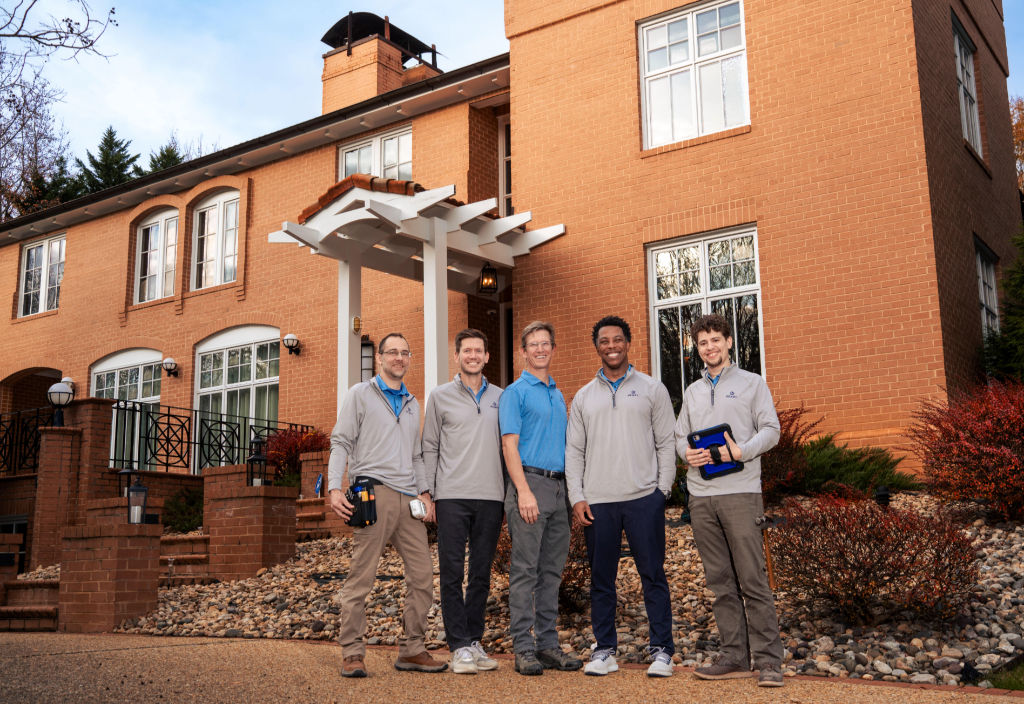 The Henry team standing together outside a customer home