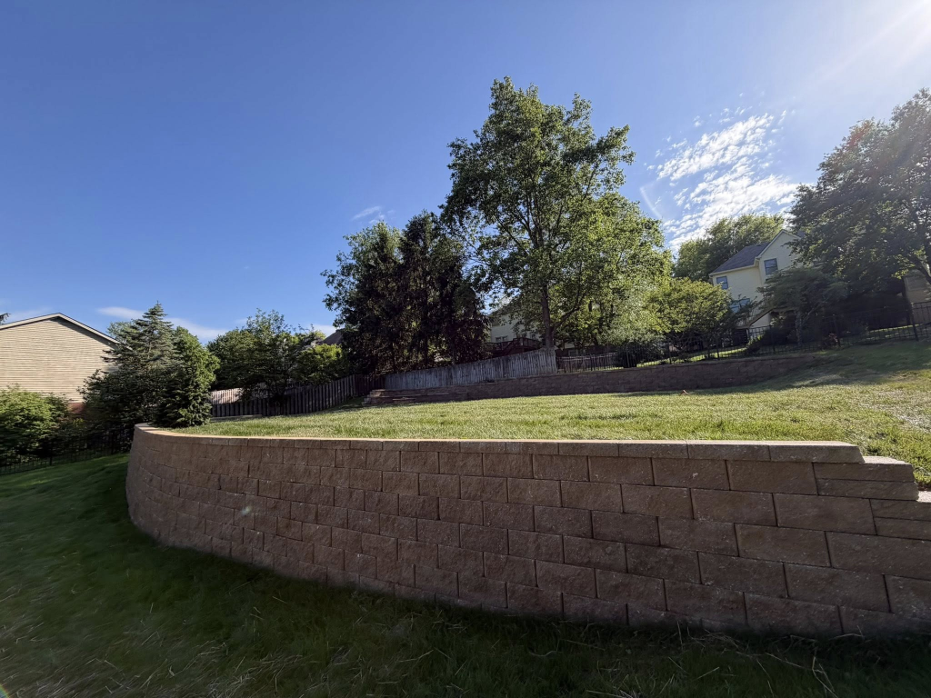 Backyard Transformation - Retaining Walls, Stamped Patio & Custom Fire Pit 2