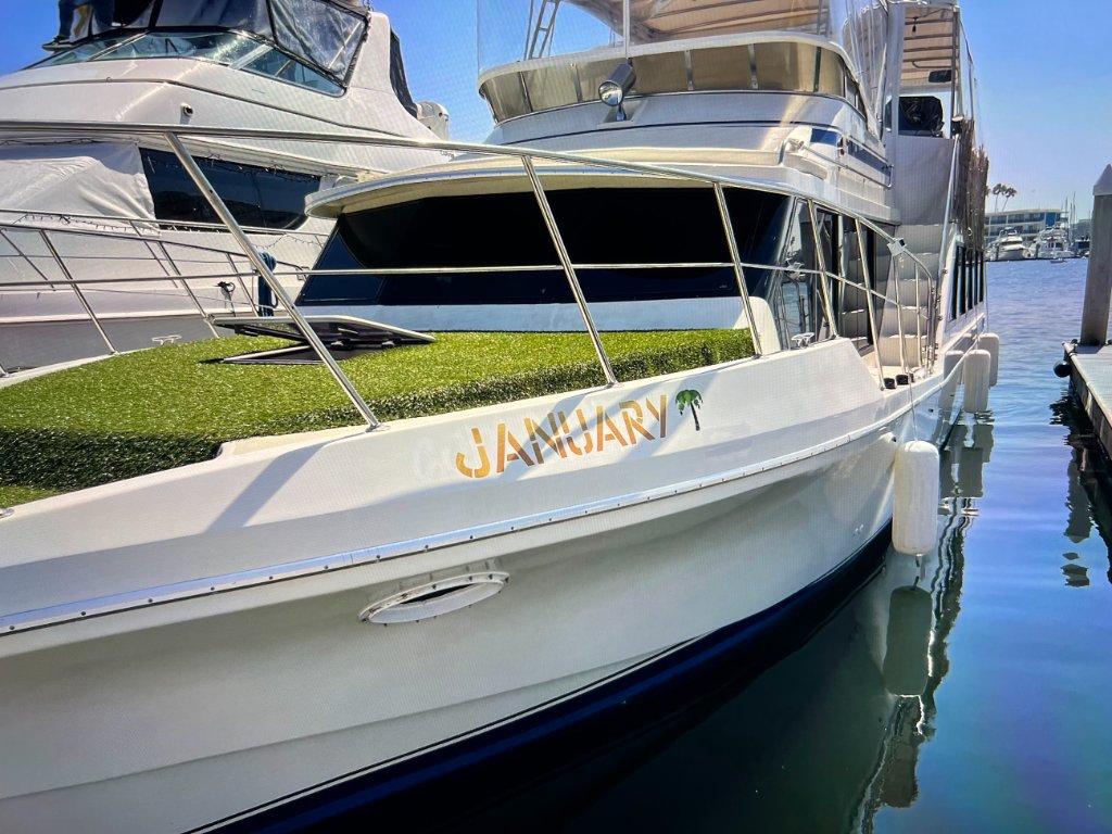 January yacht name graphic with bow deck detail