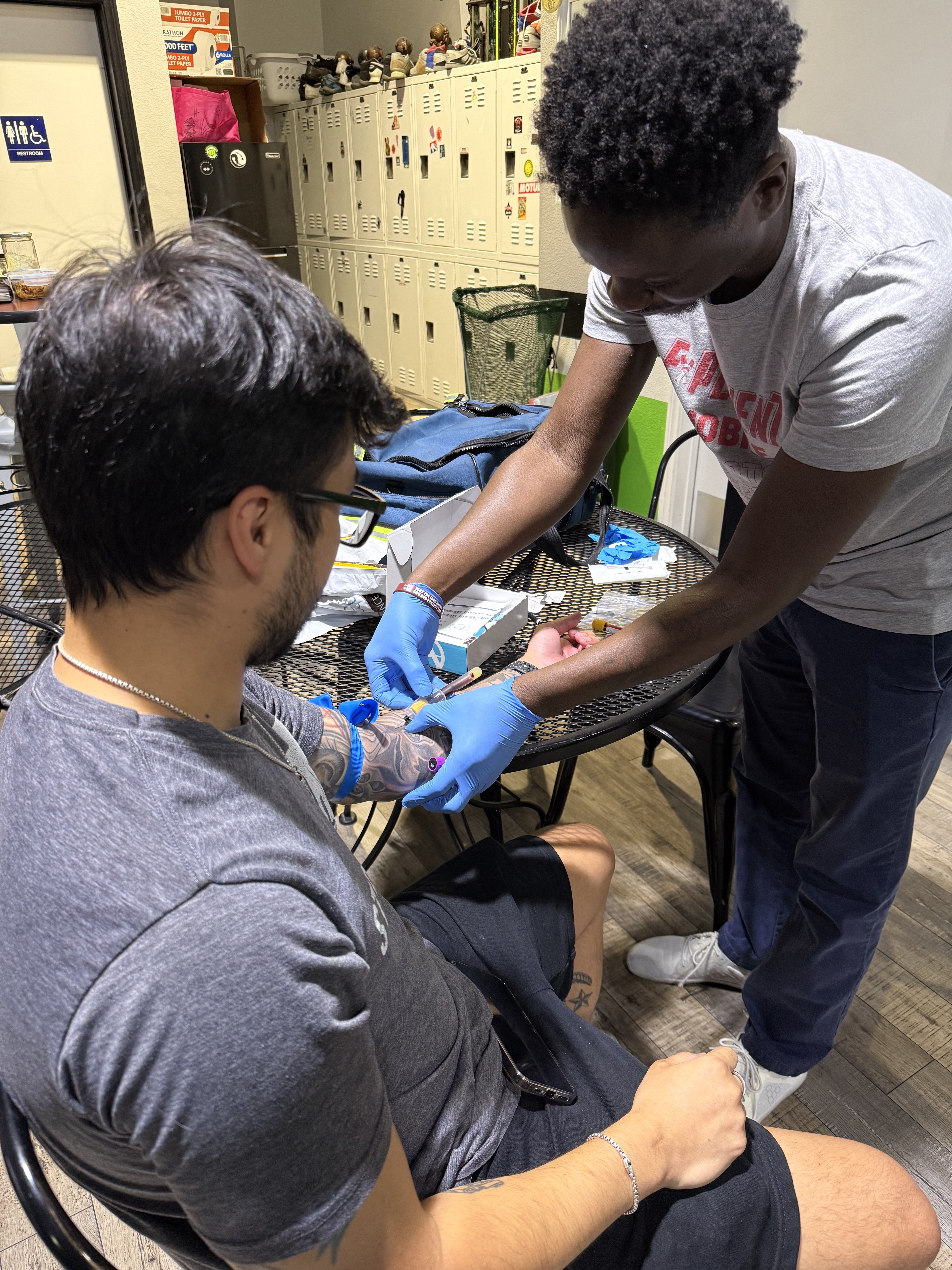 A licensed phlebotomist. About 15 minutes.
