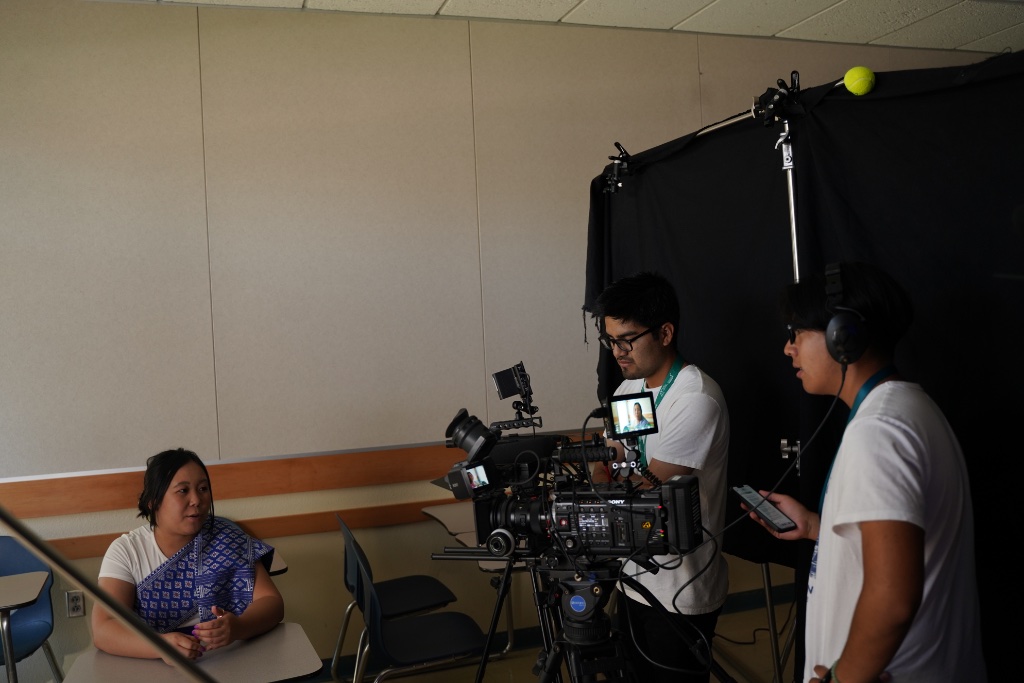 Production crew filming interview