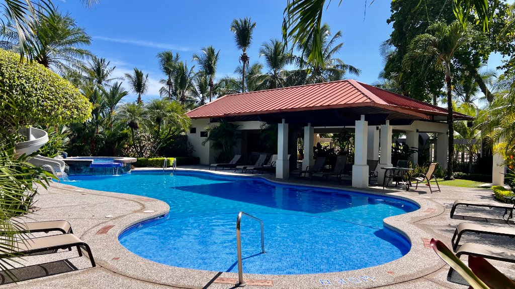 Resort pool at Jaco Beach vacation rentals - poolside amenities in Costa Rica