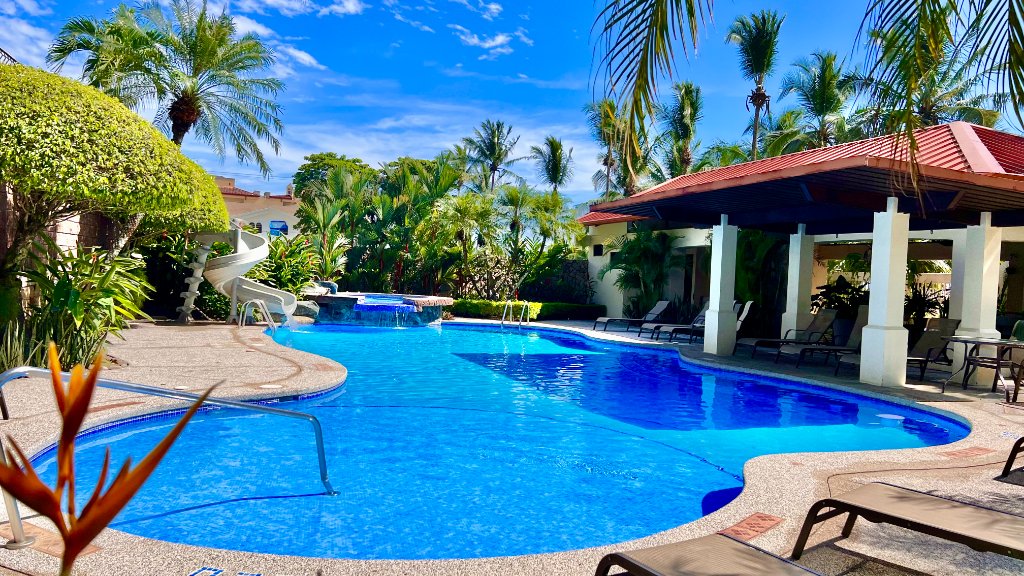 Tropical resort pool with waterfall at Jaco Beach Costa Rica vacation rentals