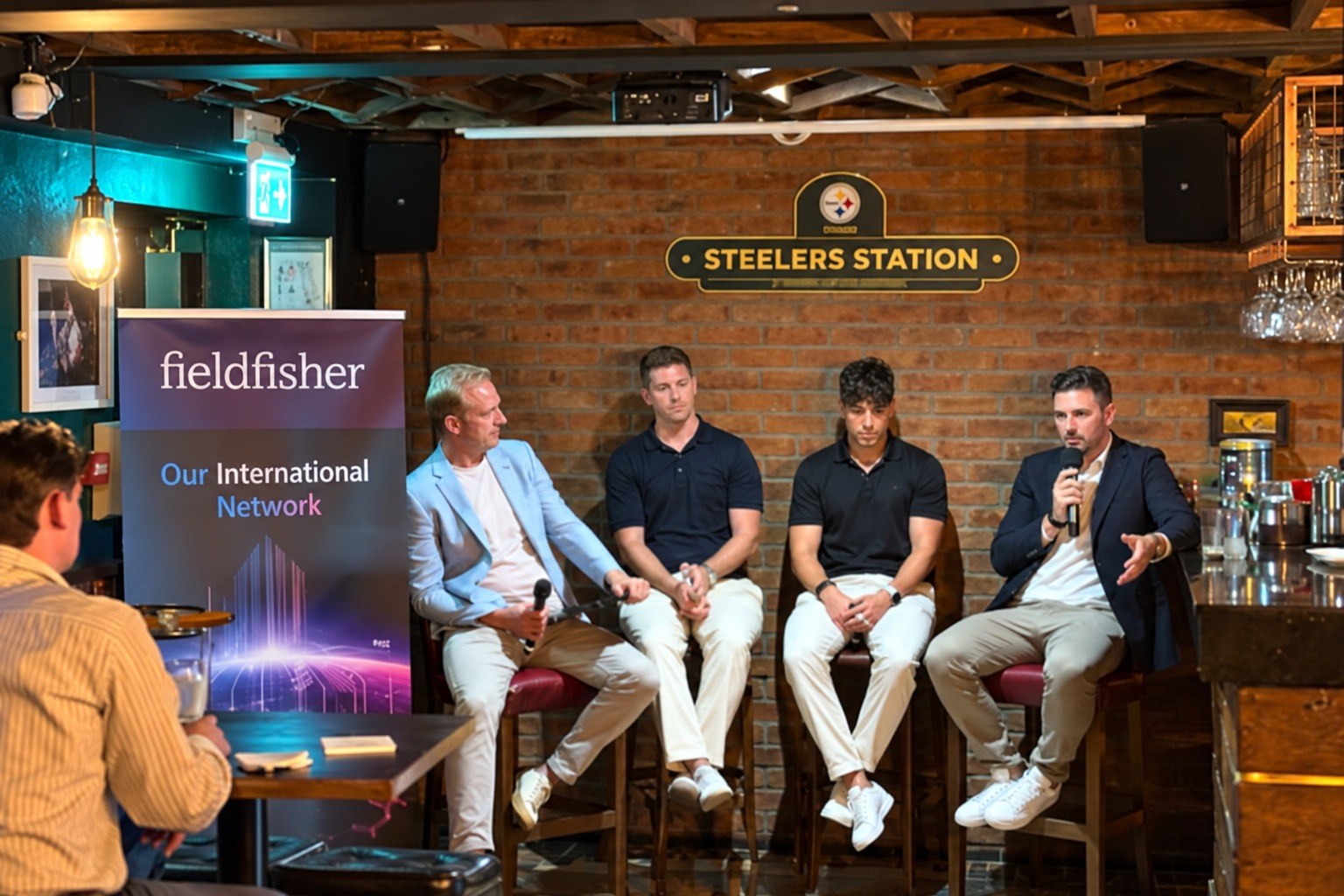 Sales leaders seated in front of the Fieldfisher banner at the SpringboardIQ event in Dublin