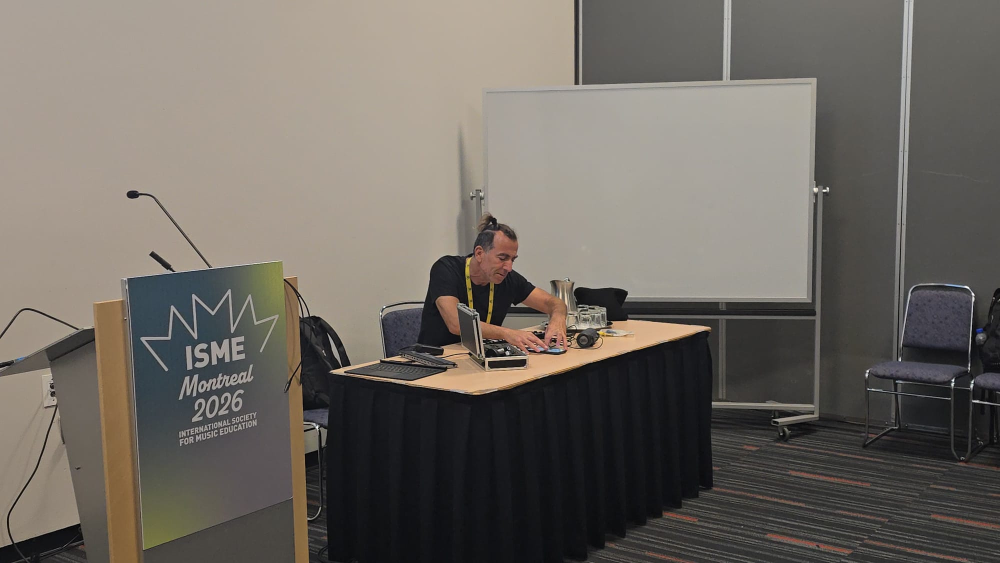 ISME Montréal 2026 — conference booth and demo table