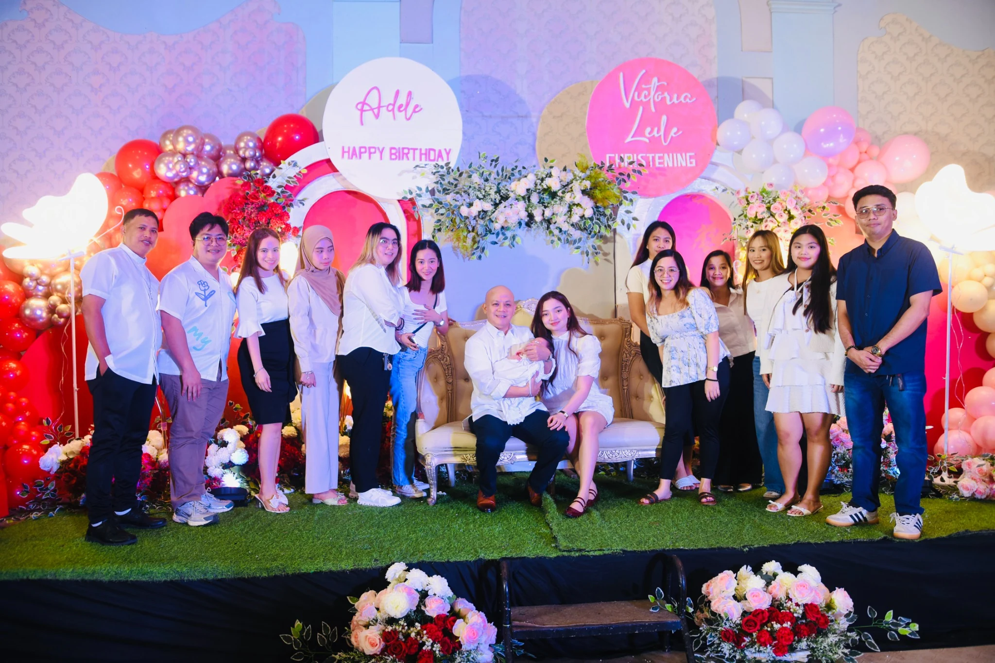 Another group portrait with the baby at the floral reception stage.
