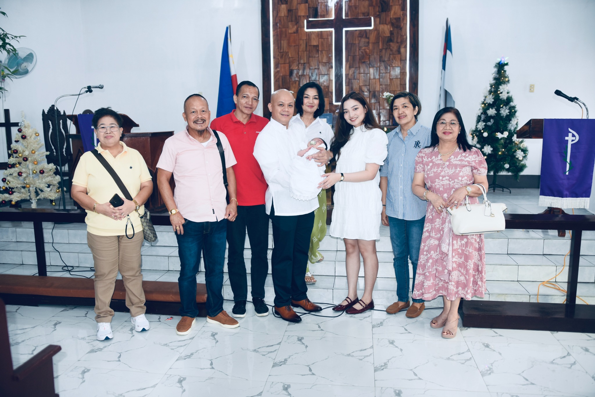 Family and loved ones gathered with Victoria Liele at the church after her baptism.