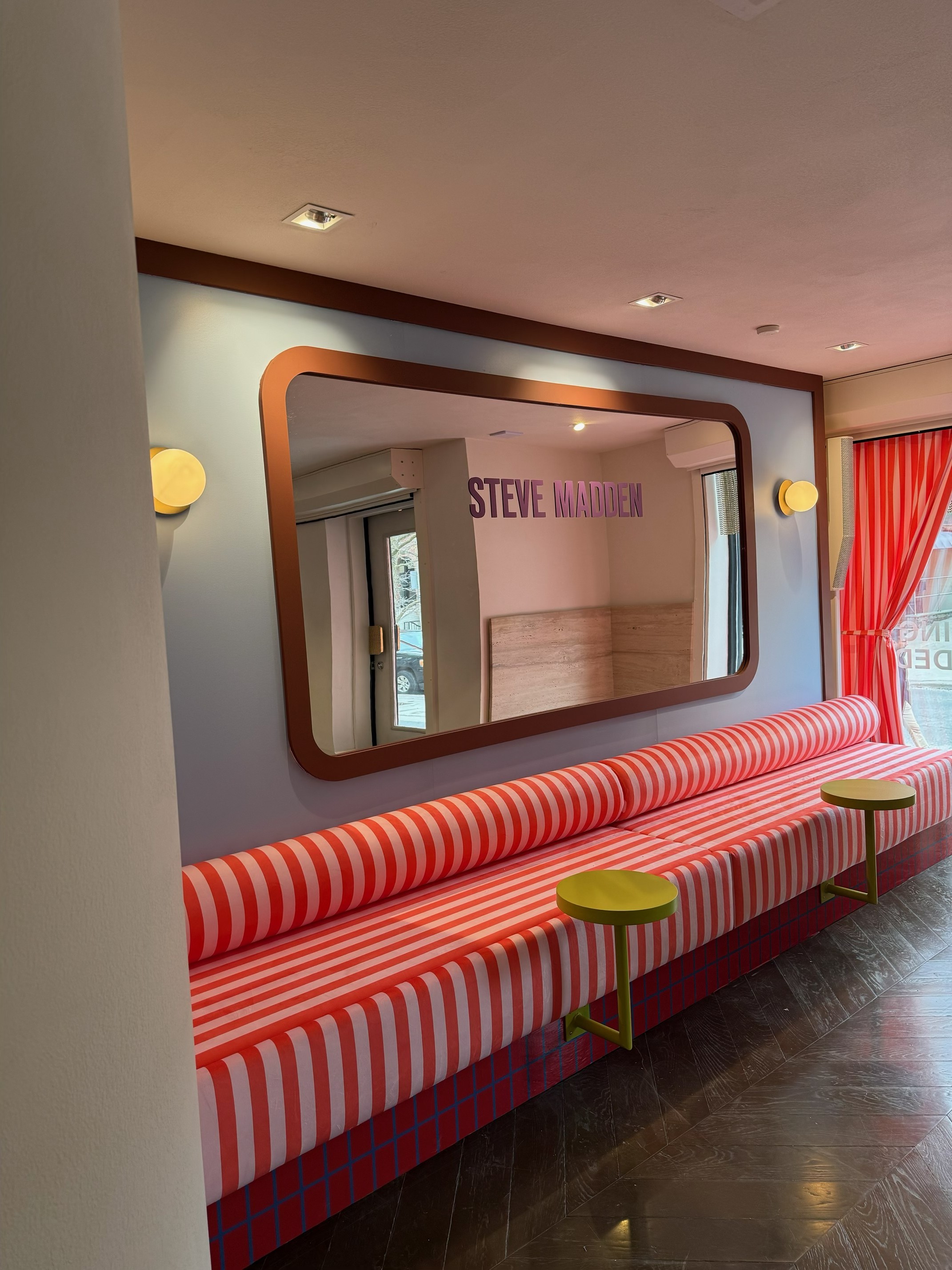 Red and white striped upholstery at the Steve Madden installation