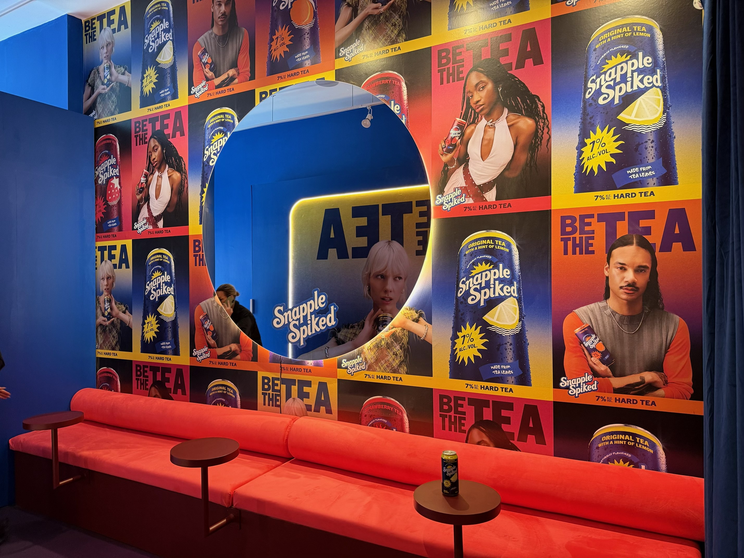 Snapple Spiked branded installation with printed backdrop and red seating