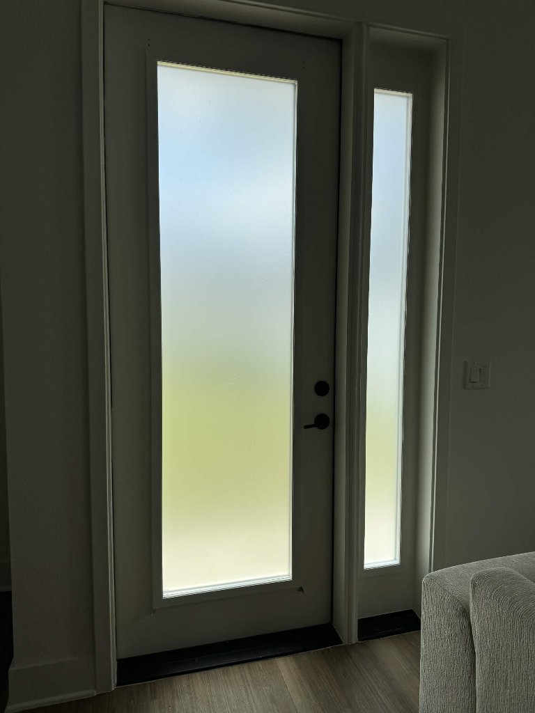Frosted privacy window film on entry door and sidelight in Pinellas County