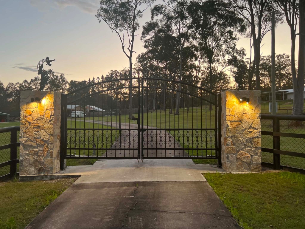 Large Farm Swing Gate at Dusk