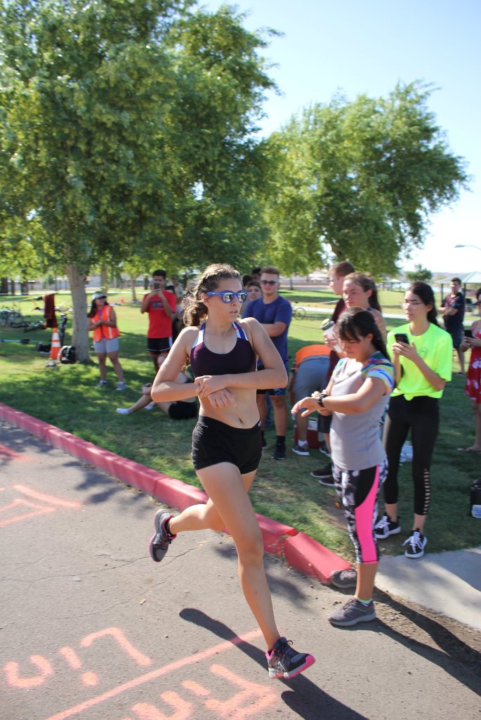 Desert Juggernauts runner crossing finish line at annual triathlon Bullhead City Arizona