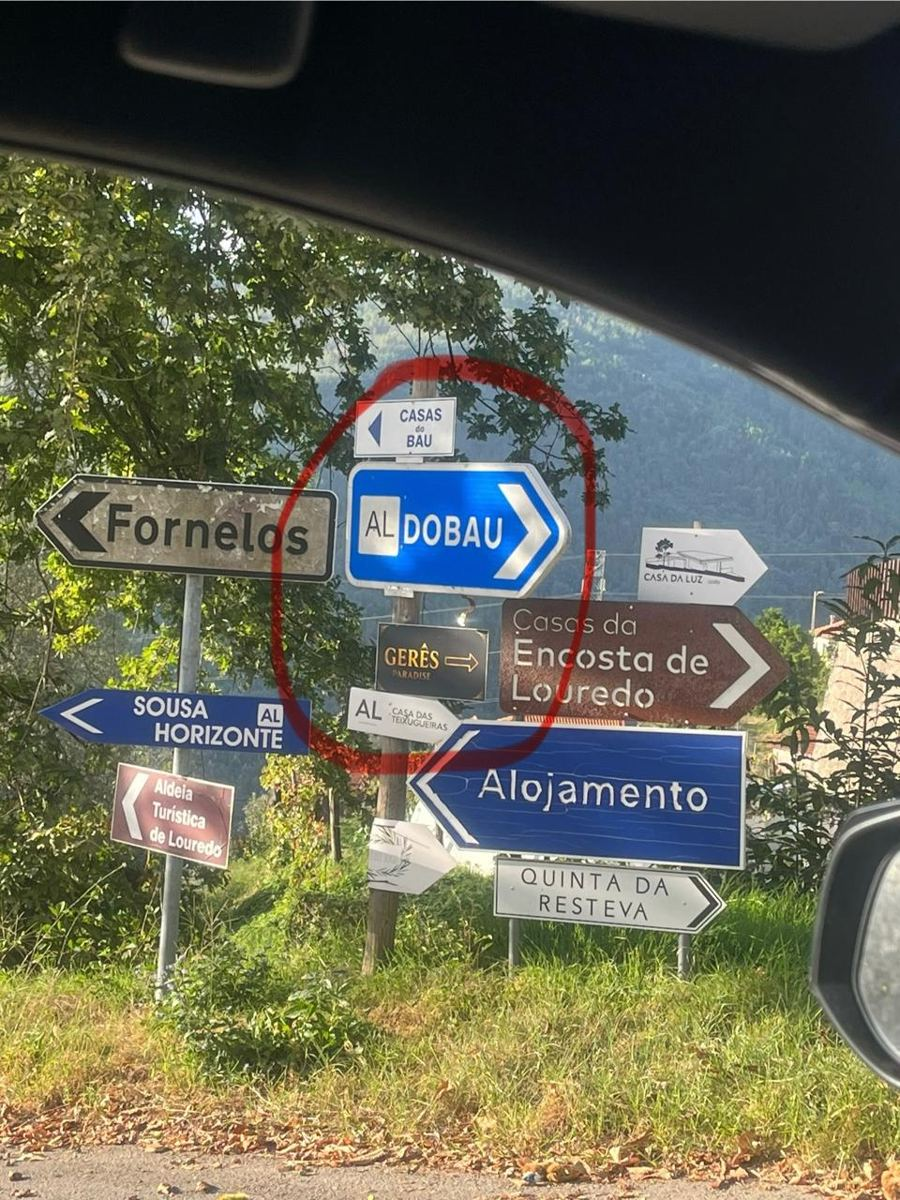 Blue AL DOBAU sign