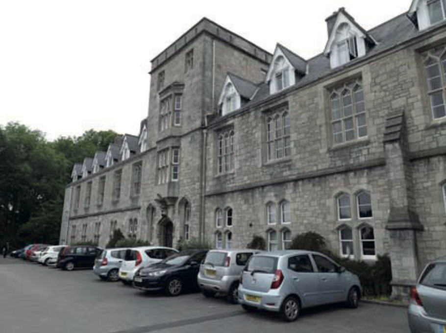 Members' cars parked outside St. Beuno's