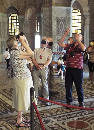Pilgrims viewing mosaics