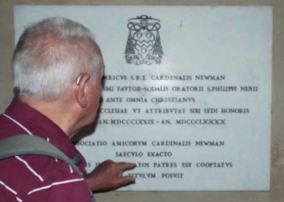 Fr Pat examines Newman's commemoration stone