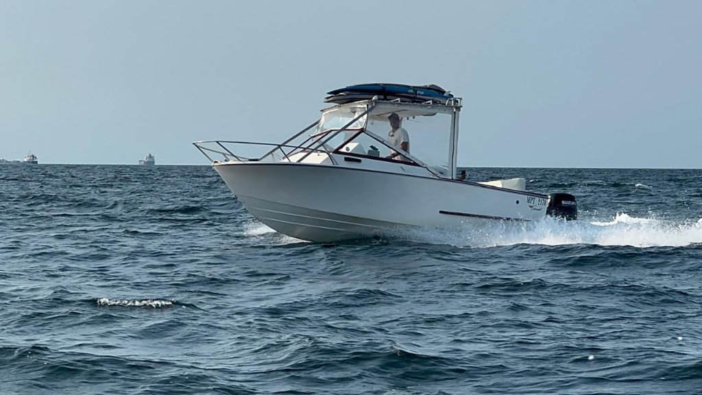 Own powerboat under way, Maputo Bay