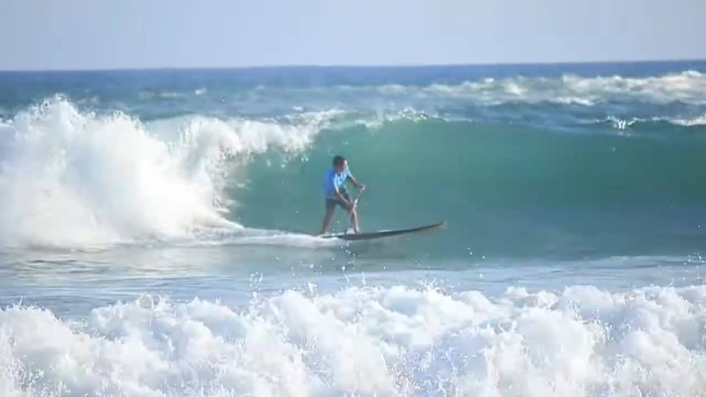 SUP surfing a wave, Sri Lanka