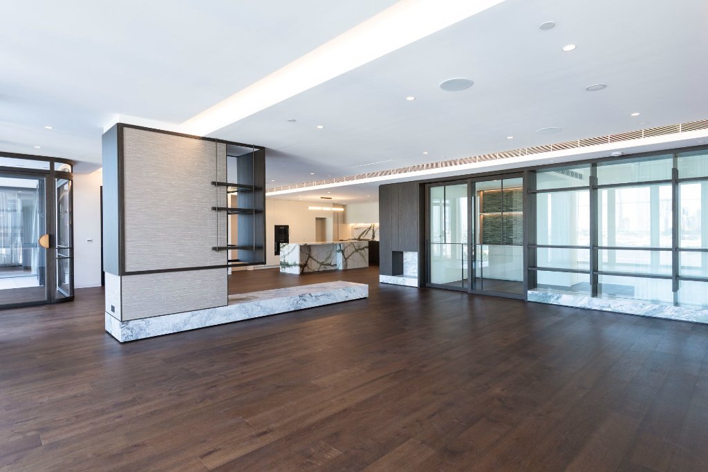 Open plan penthouse with TV concealed