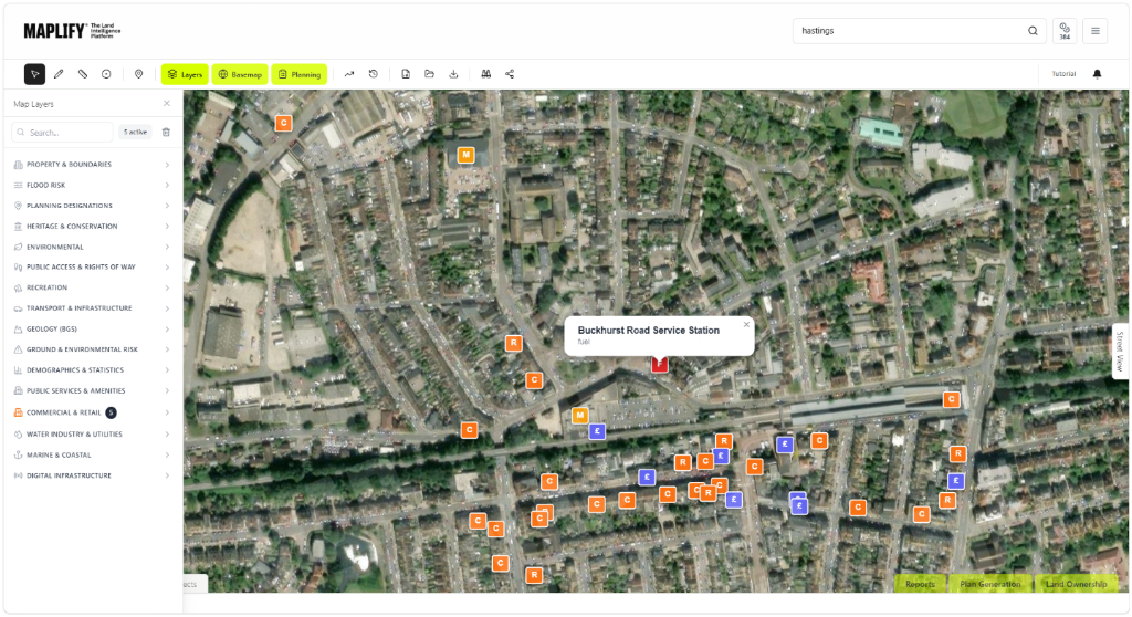 Commercial & Retail layer shown on the Maplify map with site intelligence data Maplify map screenshot showing the Commercial & Retail layer over Hastings, with supermarket, bank, restaurant and pub markers alongside site intelligence data